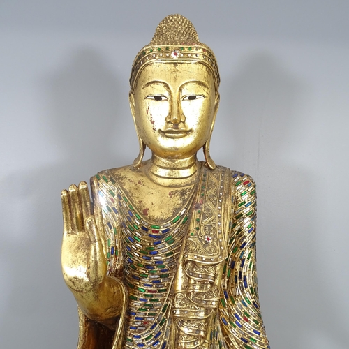 2586 - A large gilt painted resin figure of a buddha on plinth, with applied cut mirrored glass decoration.... 