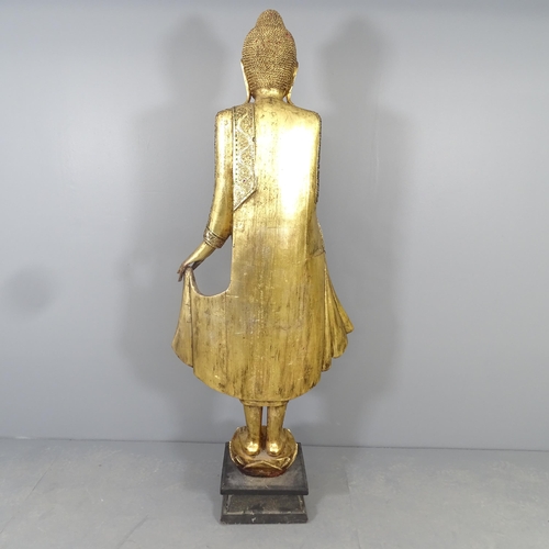 2586 - A large gilt painted resin figure of a buddha on plinth, with applied cut mirrored glass decoration.... 