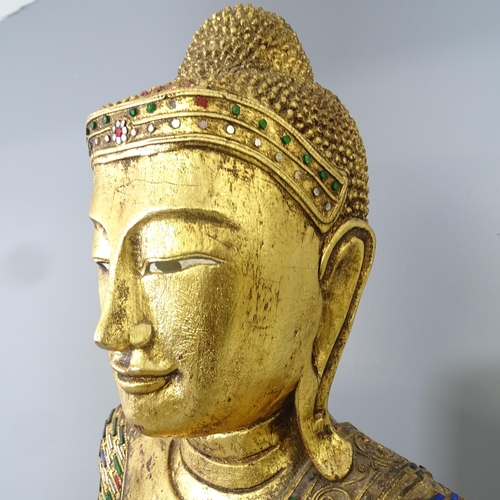 2586 - A large gilt painted resin figure of a buddha on plinth, with applied cut mirrored glass decoration.... 