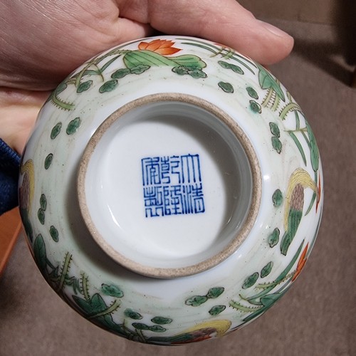 160 - A Chinese porcelain bowl with painted duck and lily flower designs, Qianlong seal mark under, diamet... 