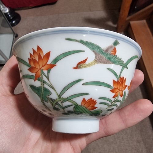 160 - A Chinese porcelain bowl with painted duck and lily flower designs, Qianlong seal mark under, diamet... 