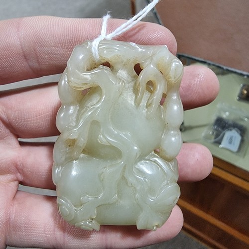 195 - A Chinese relief carved jade double-gourd ornament, height 6cm