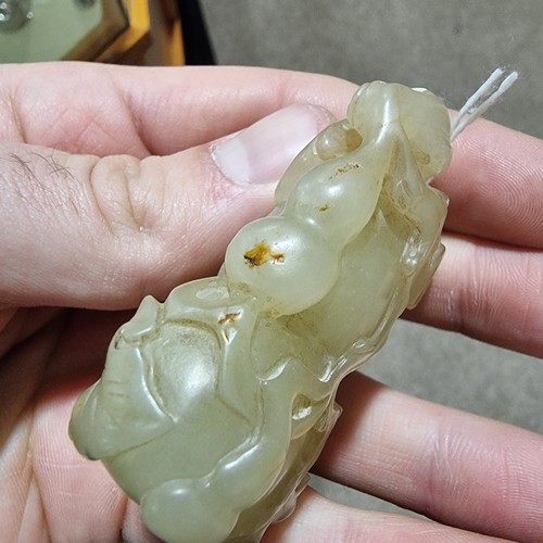 195 - A Chinese relief carved jade double-gourd ornament, height 6cm