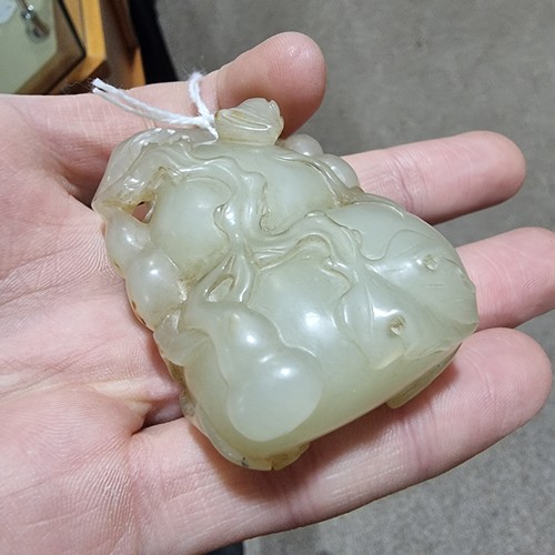 195 - A Chinese relief carved jade double-gourd ornament, height 6cm