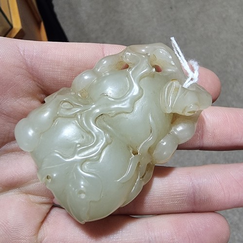 195 - A Chinese relief carved jade double-gourd ornament, height 6cm