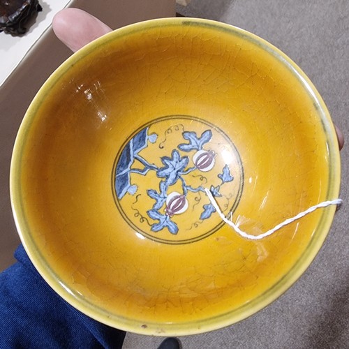 220 - A yellow Chinese stem bowl with blue under-glaze decoration, character marks inside base, height 10.... 