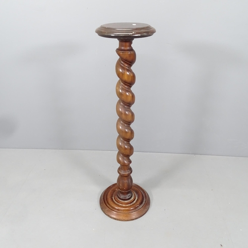 2131 - A mahogany jardiniere stand with spiral turned column. H - 99cm.