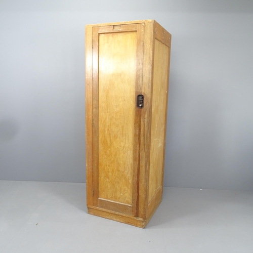 2134 - An early 20th century oak single door locker with shelved interior. 60x172x58cm