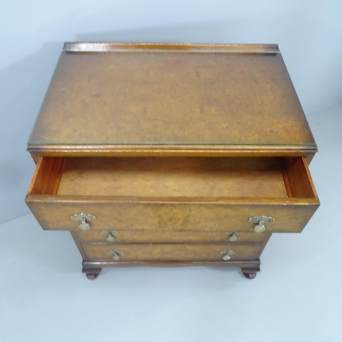 2140 - A 1930s burr walnut chest of four long drawers, raised on cabriole legs. 81x93x49cm