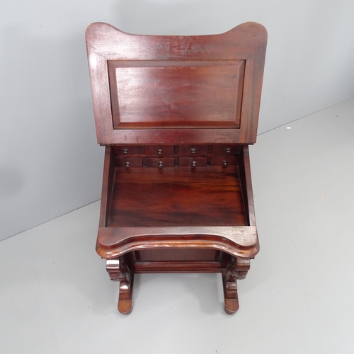 2143 - A reproduction teak Davenport. 55x85x55cm