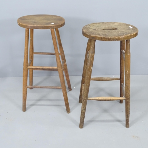 2145 - Two similar vintage elm-seated stools. Tallest 76cm