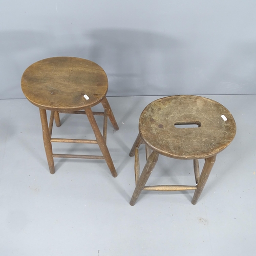 2145 - Two similar vintage elm-seated stools. Tallest 76cm