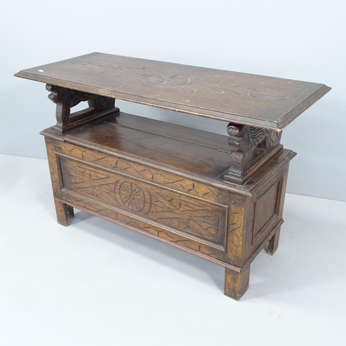 2148 - An early 20th century oak monk's bench. Dimensions (closed) 107x68x46cm