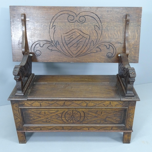 2148 - An early 20th century oak monk's bench. Dimensions (closed) 107x68x46cm