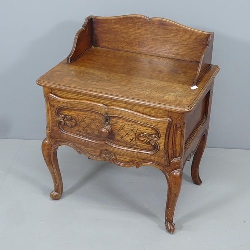 2150 - A pair of French oak bedside tables, with single drawer and raised on cabriole legs. 55x75x40cm