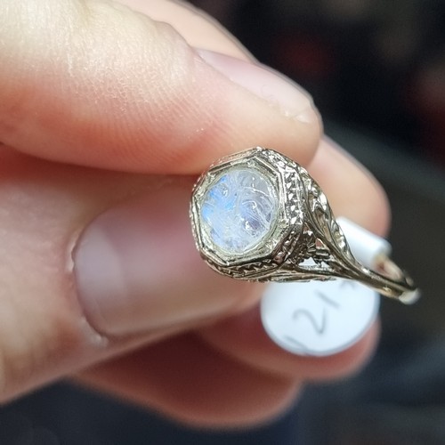 1217 - An Art Deco moonstone 'man in the moon' ring, unmarked gold settings with octagonal head and pierced... 