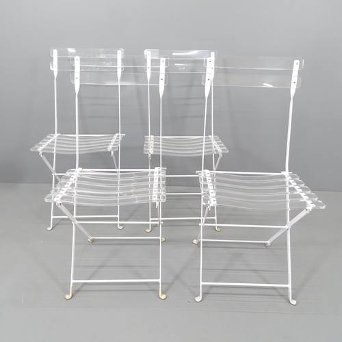 2153 - A set of 4 Lucite and white enamelled steel folding chairs.