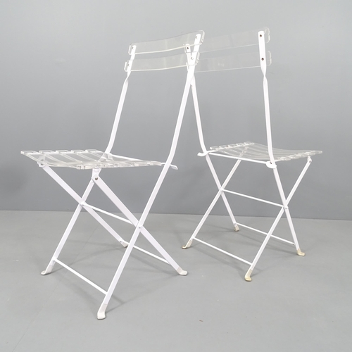 2153 - A set of 4 Lucite and white enamelled steel folding chairs.