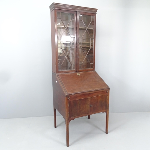 2157 - An antique two-section bureau bookcase, the top section having two lattice glazed doors and three ad... 