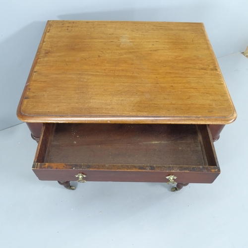 2158 - A Victorian writing table, with single frieze drawer and raised on turned legs with brass casters. 7... 