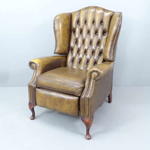 2161 - A button-back leather upholstered reclining armchair. Overall 80x112x90cm, seat 48x50x54cm.