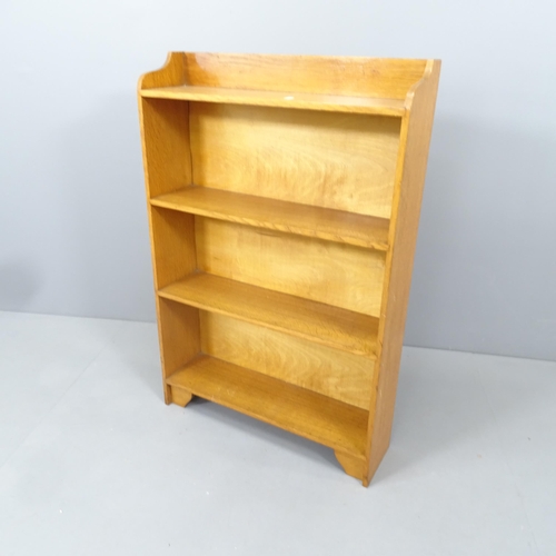 2164 - A small light oak open bookcase. 61x91x17cm