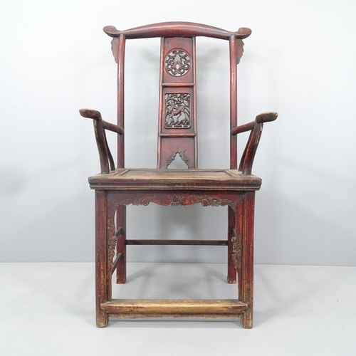 2167 - An antique elm Chinese emperor's throne chair, with carved and pierced decoration. Overall 68x118x52... 