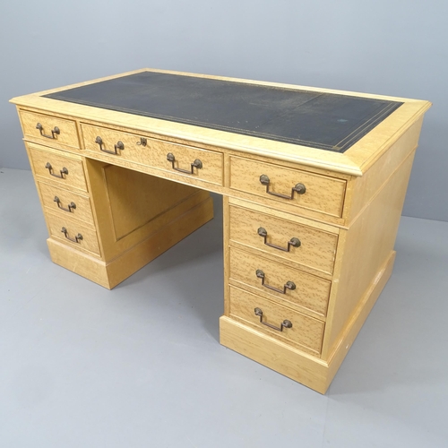 2173 - A modern birds eye maple veneered twin pedestal writing desk, with black leather skiver and nine dra... 