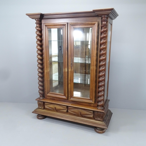 2176 - A Dutch mahogany mirror backed display cabinet, with three fixed glass shelves, two glazed doors wit... 