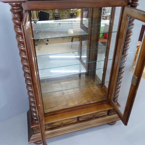 2176 - A Dutch mahogany mirror backed display cabinet, with three fixed glass shelves, two glazed doors wit... 