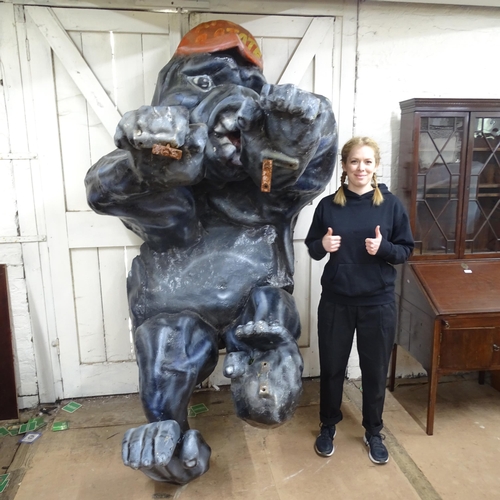 2179 - A large and impressive fibreglass Gorilla wall/roof ornament. Overall approximately 135x250x130cm