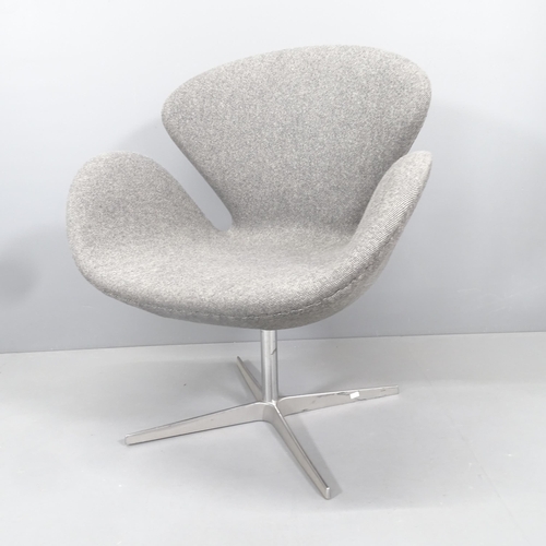 2255 - A mid-century style swivel lounge chair in the manner of the Jacobsen Swan chair.