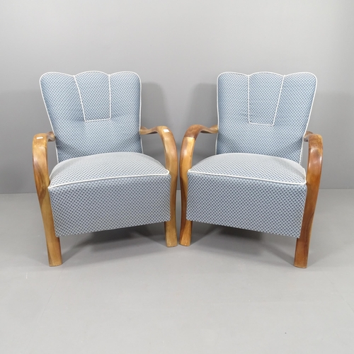 2262 - A pair of Art Deco style walnut and upholstered open arm lounge chairs, recently re-upholstered in F... 