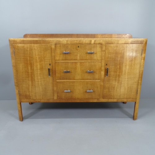 2270 - An Art Deco oak sideboard by Heal's of London with three central drawers, two side cupboards, and in... 