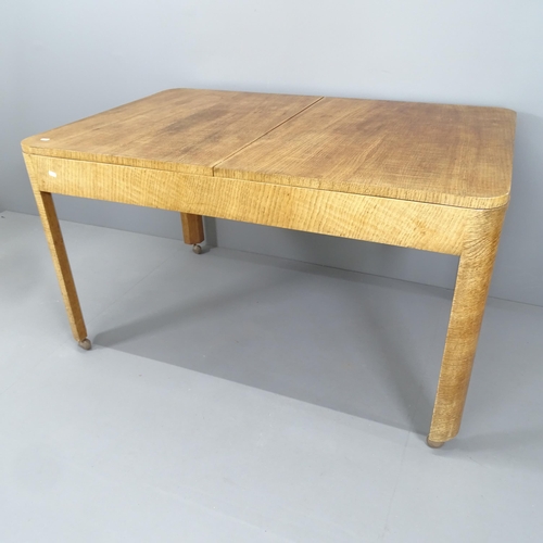 2271 - An Art Deco oak draw-leaf dining table by Heals of London, 130 (extending to 184cm) x74x84cm, and si... 