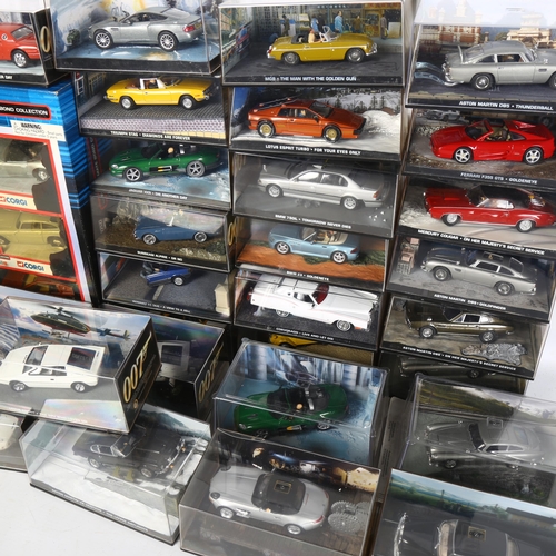 165 - A quantity of James Bond related diecast vehicles, in display cases and original packaging, includin... 