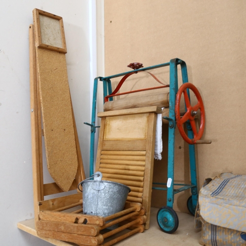 194 - A Vintage green doll's highchair, the chair does fold down into a lower seated position, height full... 