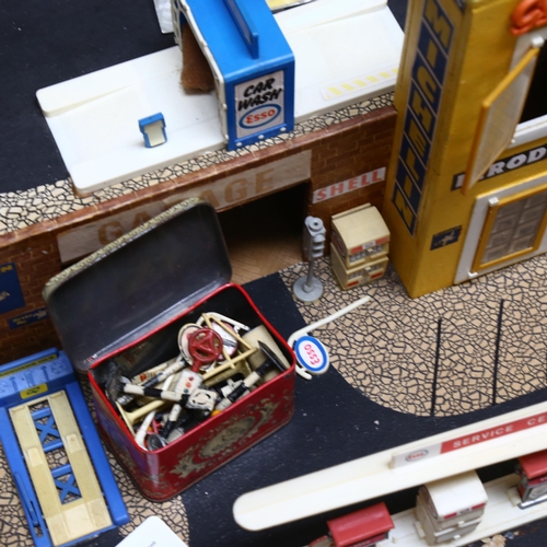 202 - A Vintage scratch-built wooden toy garage, to include various accessories, and a tin of Vintage lead... 