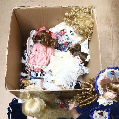 213 - A large quantity of porcelain dolls, unboxed, some on display stands