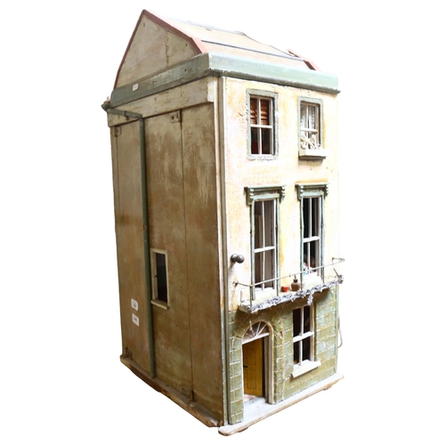 230 - A Vintage doll's house in the style of a townhouse, spread over 3 floors with fitted interior, inclu... 