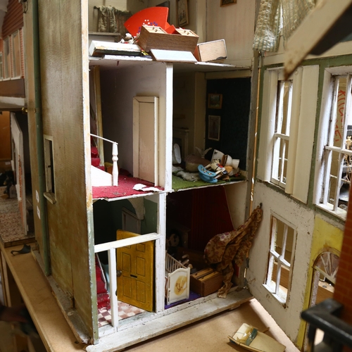 230 - A Vintage doll's house in the style of a townhouse, spread over 3 floors with fitted interior, inclu... 