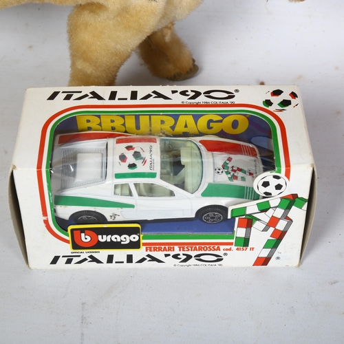 235 - A Vintage Rosko Toy Josie battery operated cow, a boxed Burago Italia 90 diecast vehicle, and a Vint... 