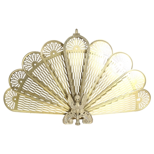 256 - A phoenix design brass fan fire screen, height 58cm, width 95cm