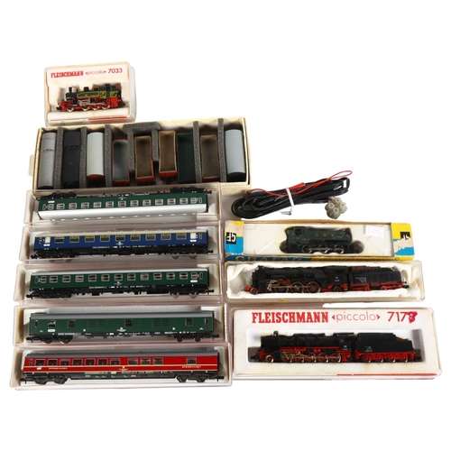 27 - A quantity of N gauge locomotives, coaches and goods wagons, including Fleischmann, Arnold, Grafar R... 