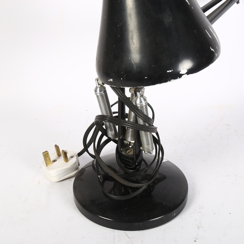 282 - HERBERT TERRY - a mid-century black anglepoise lamp on circular base, stamped to the bottom of the s... 