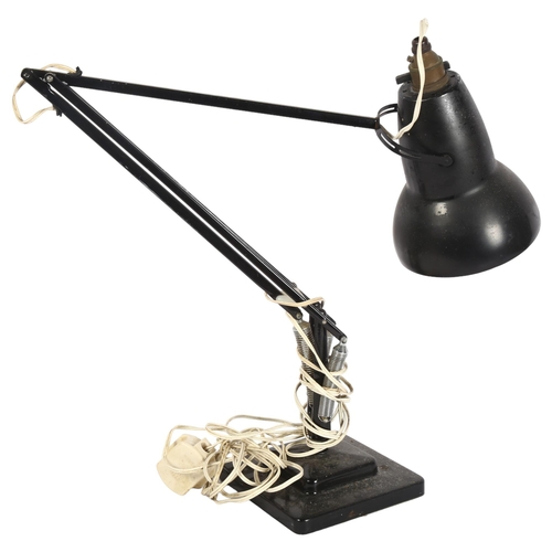 283 - HERBERT TERRY -a mid-century black anglepoise lamp on stepped base, stamp mark to the bottom of the ... 