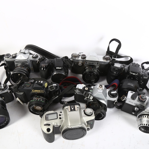 317 - A collection of various cameras, to included a Pentax S1A no. 646213, with auto-reflex lens, a Canon... 