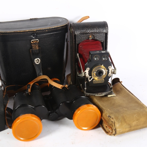 319 - A Kodak no. 120 camera, an Eastman Kodak no. 1A folding pocket camera with canvas case, and a pair o... 