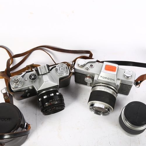 324 - A Zenit-E camera with a Helios-44-2 lens, a Topcon RE-2 camera and lens case, and an RE-auto Top Cor... 