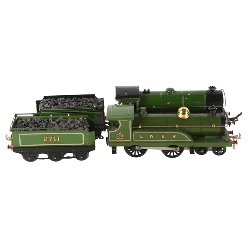 34 - HORNBY - a clockwork Hornby LMS O gauge locomotive, 2711, with tender, and a Hornby O gauge clockwor... 